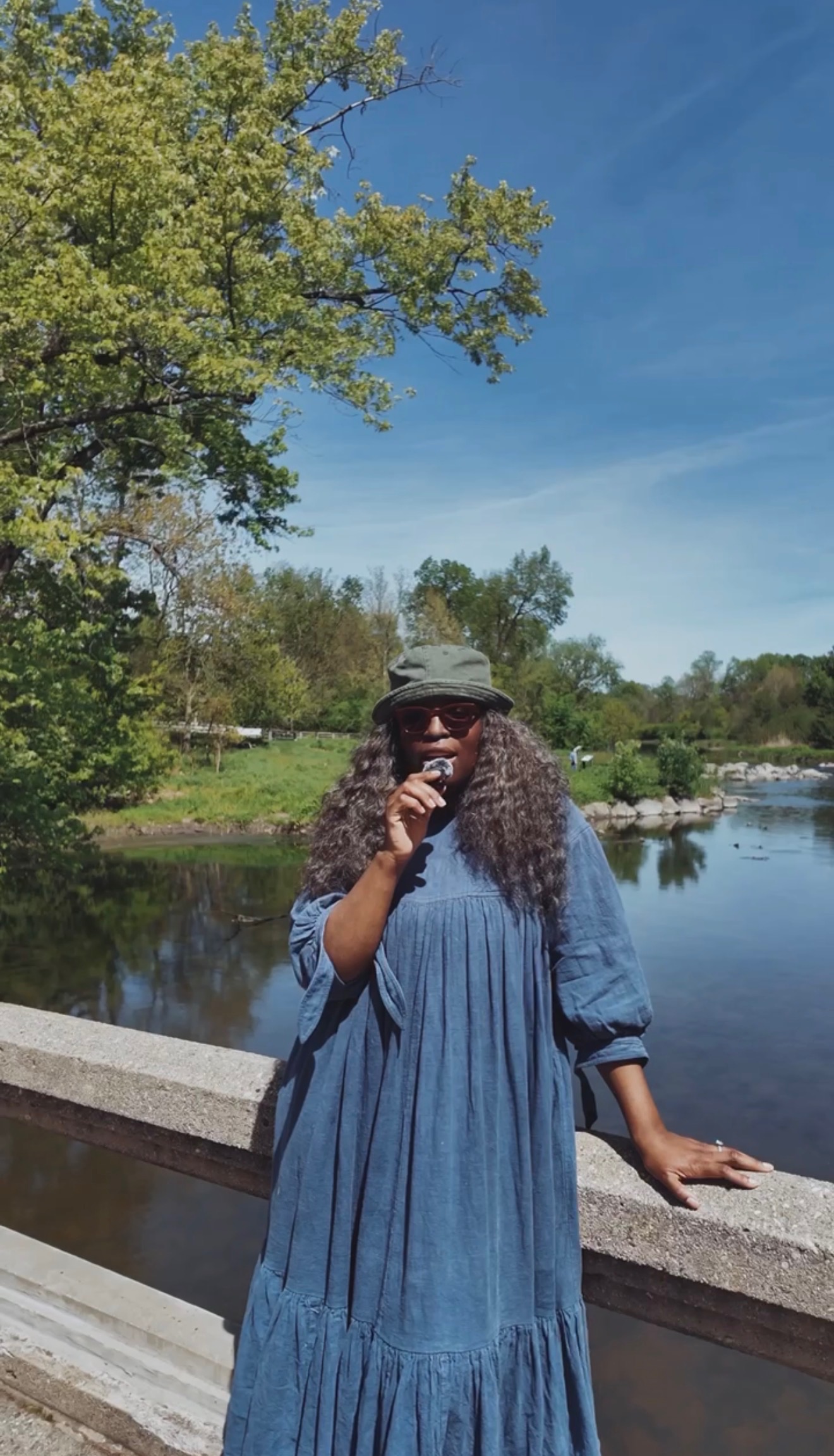 Zim standing at a creek on a piece of land